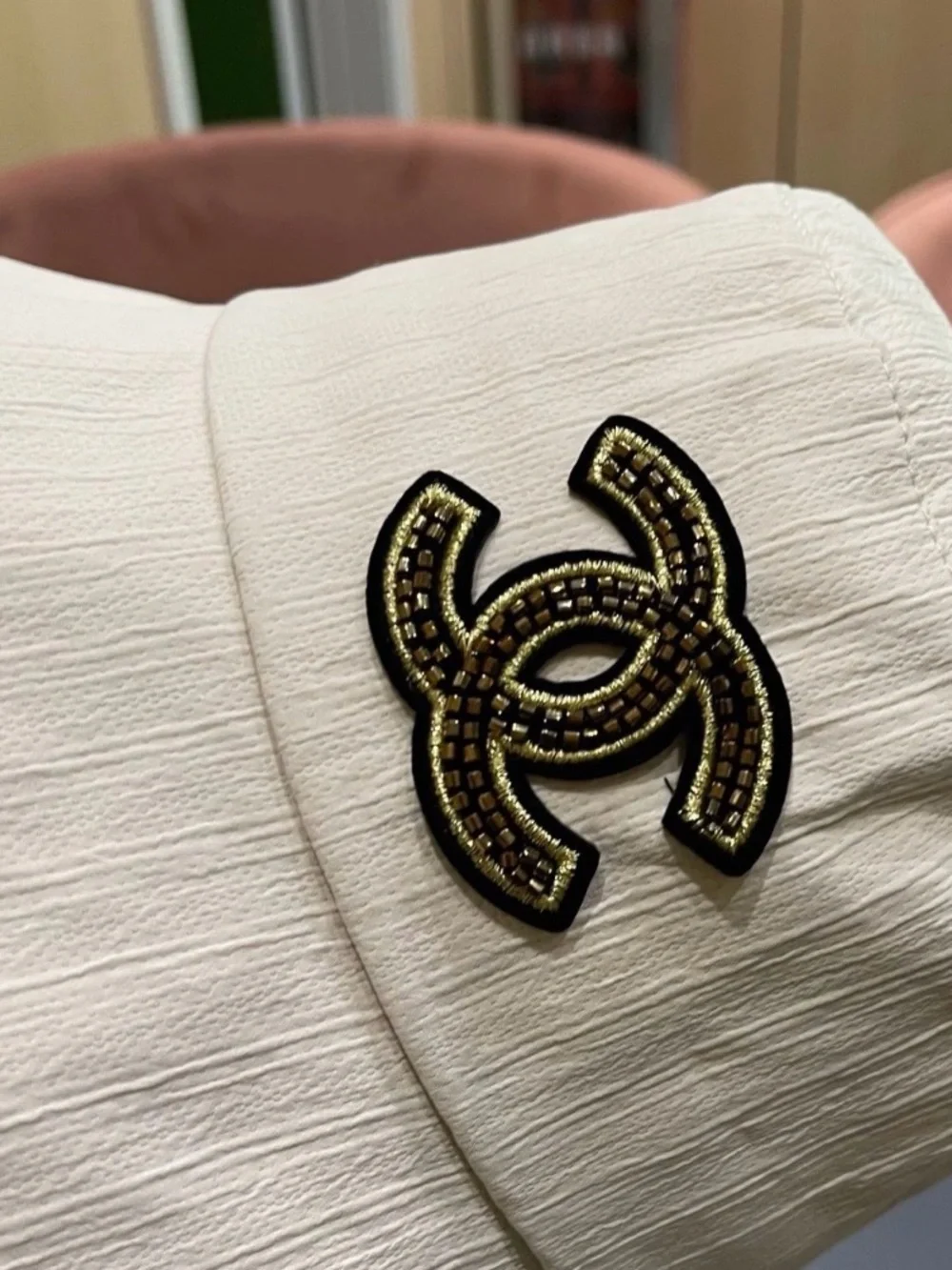 CHANEL Cream Bucket Hat with Black and Gold CC Logo